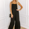 Desirable Destination Smocked Jumpsuit In Black Image - 1