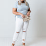 The Lola Midrise Distressed Skinny in White Curves Image - 1