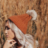 In The Know Faux Fur Pom Beanie In Dark Rust Image - 1