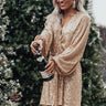 Spotlight Shine Sequin Wrap Dress in Gold Image - 1