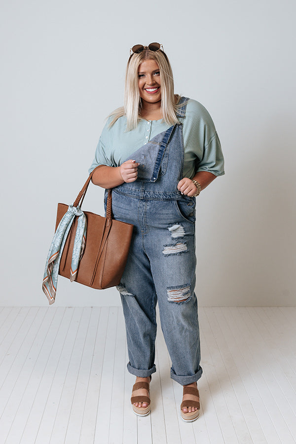 The Caspin Distressed Overalls In Medium Wash Curves
