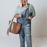 The Caspin Distressed Overalls In Medium Wash Curves Image - 1