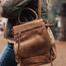 Changing Places Faux Leather Backpack In Brown Image - 1