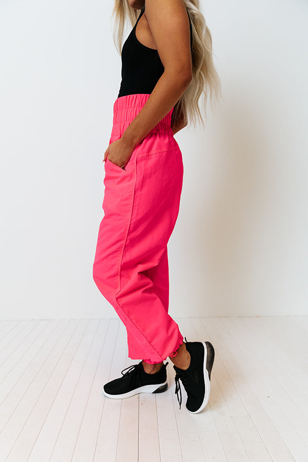 The Huxley High Waist Windbreaker Pants In Neon Hot Pink