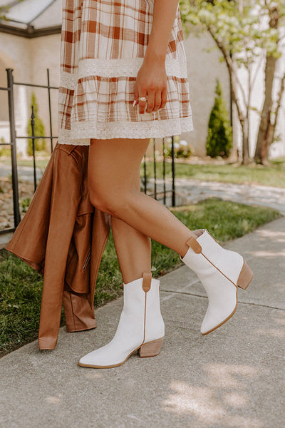 https://www.shopimpressions.com/cdn/shop/products/2207062890000-2022072810324400-74e0d52cthe-stanley-faux-leather-boot-in-ivory_grande.jpg?v=1659476560
