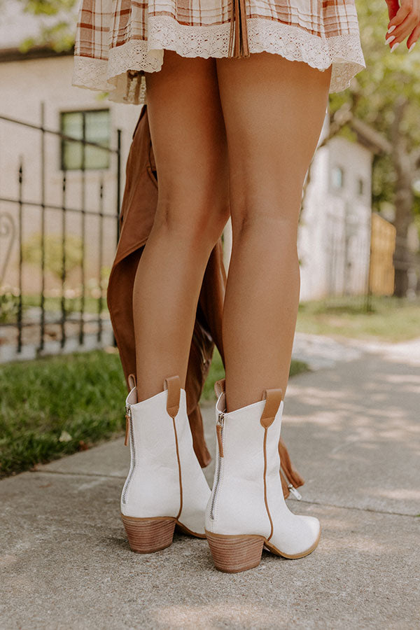 https://www.shopimpressions.com/cdn/shop/products/2207062890000-2022072810325200-9afa8fedthe-stanley-faux-leather-boot-in-ivory_1024x1024.jpg?v=1659476560