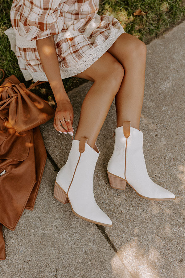 https://www.shopimpressions.com/cdn/shop/products/2207062890000-2022072810325700-c28214f9the-stanley-faux-leather-boot-in-ivory_1024x1024.jpg?v=1659476560