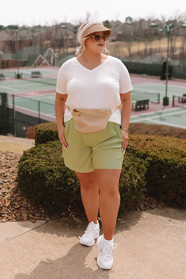 Tour The Town Pleated Shorts In Lime Punch Curves
